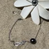 Bracelet infinity argenté avec fleur
