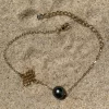 Bracelet en acier inoxydable dorée et perle de Tahiti sur sable