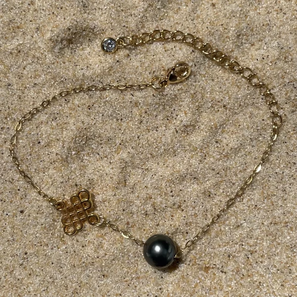 Bracelet en acier inoxydable dorée et perle de Tahiti sur sable