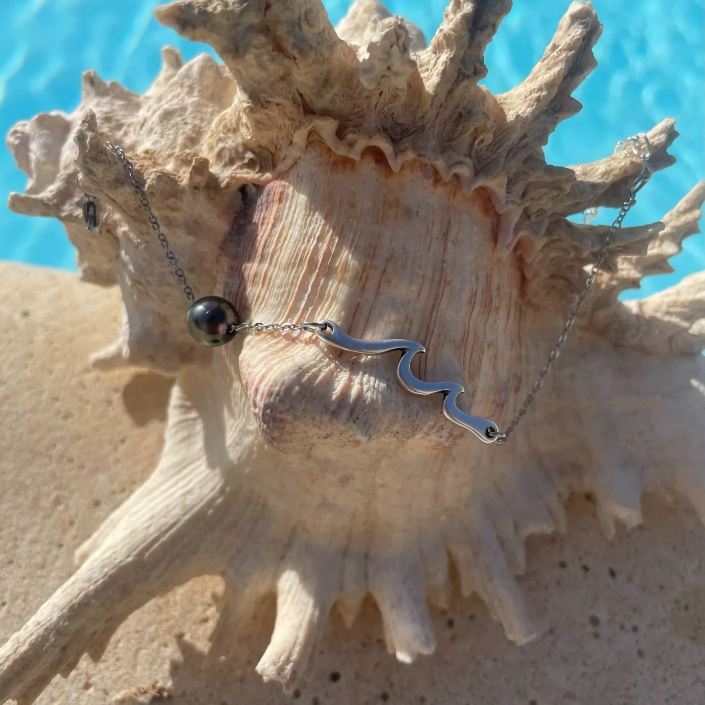 Bracelet Tai argenté sur coquillage Bracelet Tai avec perle de tahiti